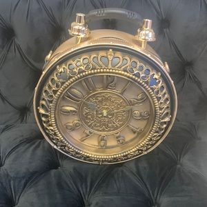 CLOCK PURSE IT HAS NEVER BEEN WORN OR USED ITS FRESH OUT OF MY BOUTIQUE! 💙